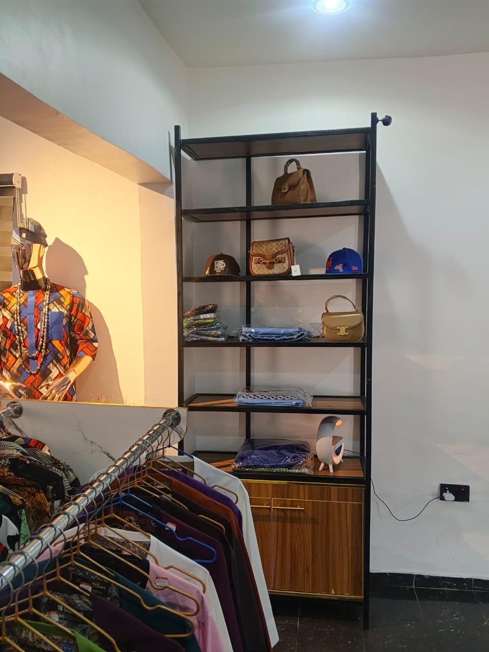 Remmy's Prestige Fashion boutique interior — garments on display